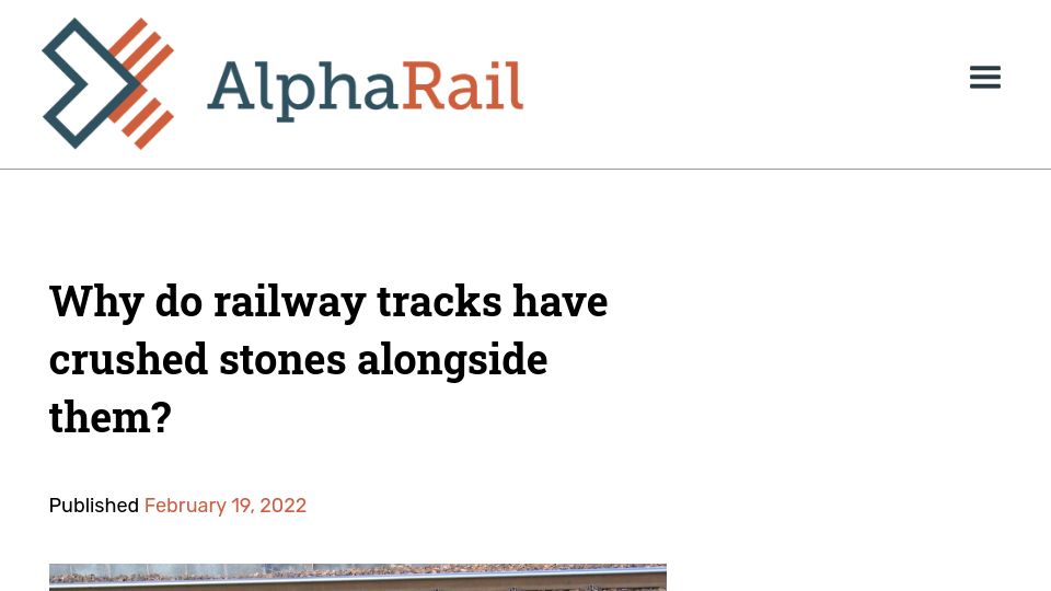 Screenshot of alpharail.co.nz: Why do railway tracks have crushed stones alongside them?