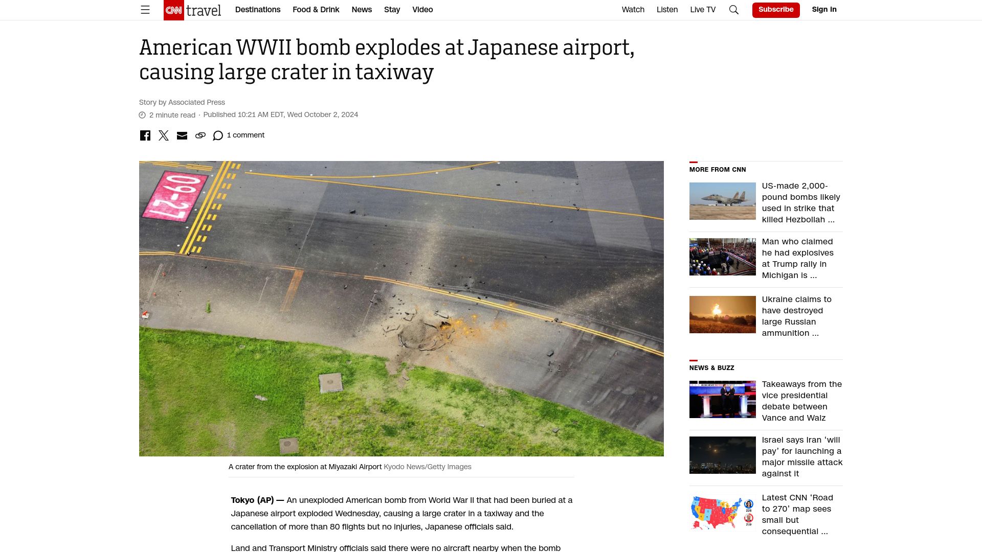 Screenshot of cnn.com: American WWII bomb explodes at Japanese airport, causing large crater in taxiway