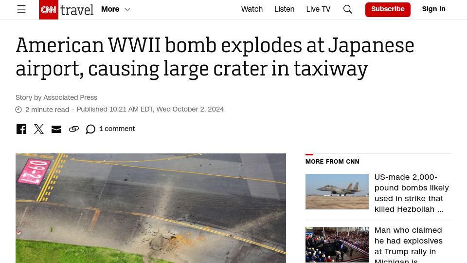 Screenshot of cnn.com: American WWII bomb explodes at Japanese airport, causing large crater in taxiway
