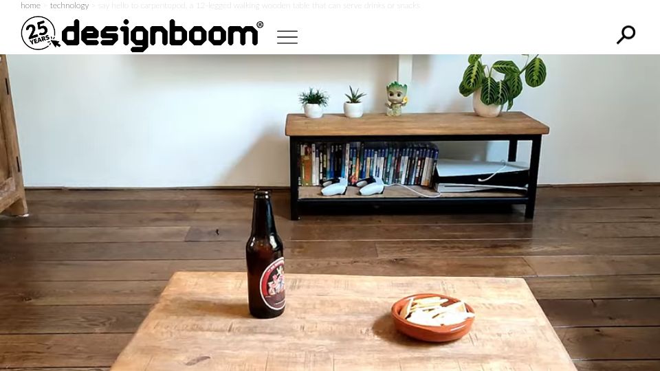 Screenshot of designboom.com: Carpentopod, a 12-legged walking wooden table that can serve drinks or snacks