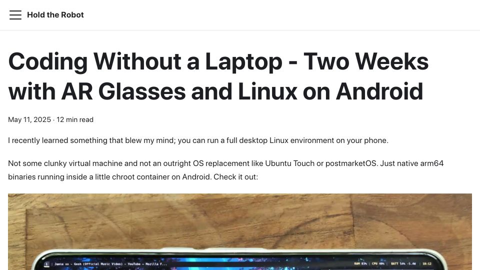 Screenshot of holdtherobot.com: Coding without a laptop: Two weeks with AR glasses and Linux on Android